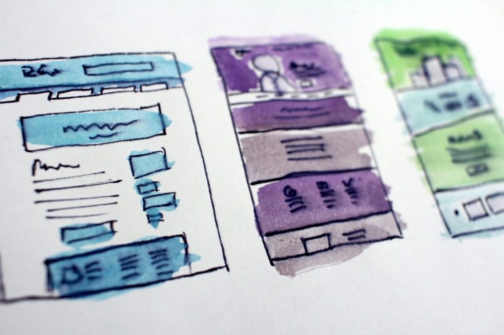 Blue, purple and green blocks drawings on a paper